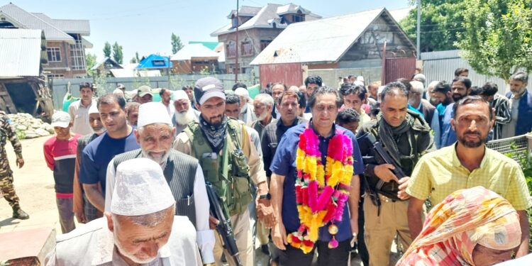 Sajad Lone visits Handwara, urges workers to intensify outreach efforts