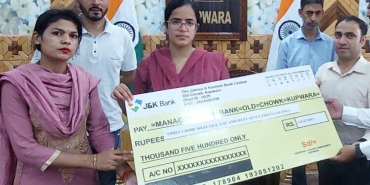 DC Kupwara hands over cheque of Rs.3.66 crore for payment under Lower Education Assistance scheme